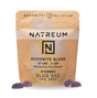 A stand-up pouch of NATREUM Goodnite Blend gummies in Blue Raz flavor, shown on a white background with three purple gummies placed in front.