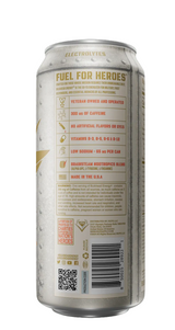 A single aluminum beverage can shown upright against a dark background, with the back panel facing the camera. The can appears metallic silver with a warm beige label and small gold accents.